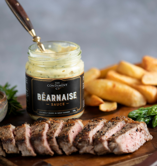 Bearnaise sauce by a sliced steak